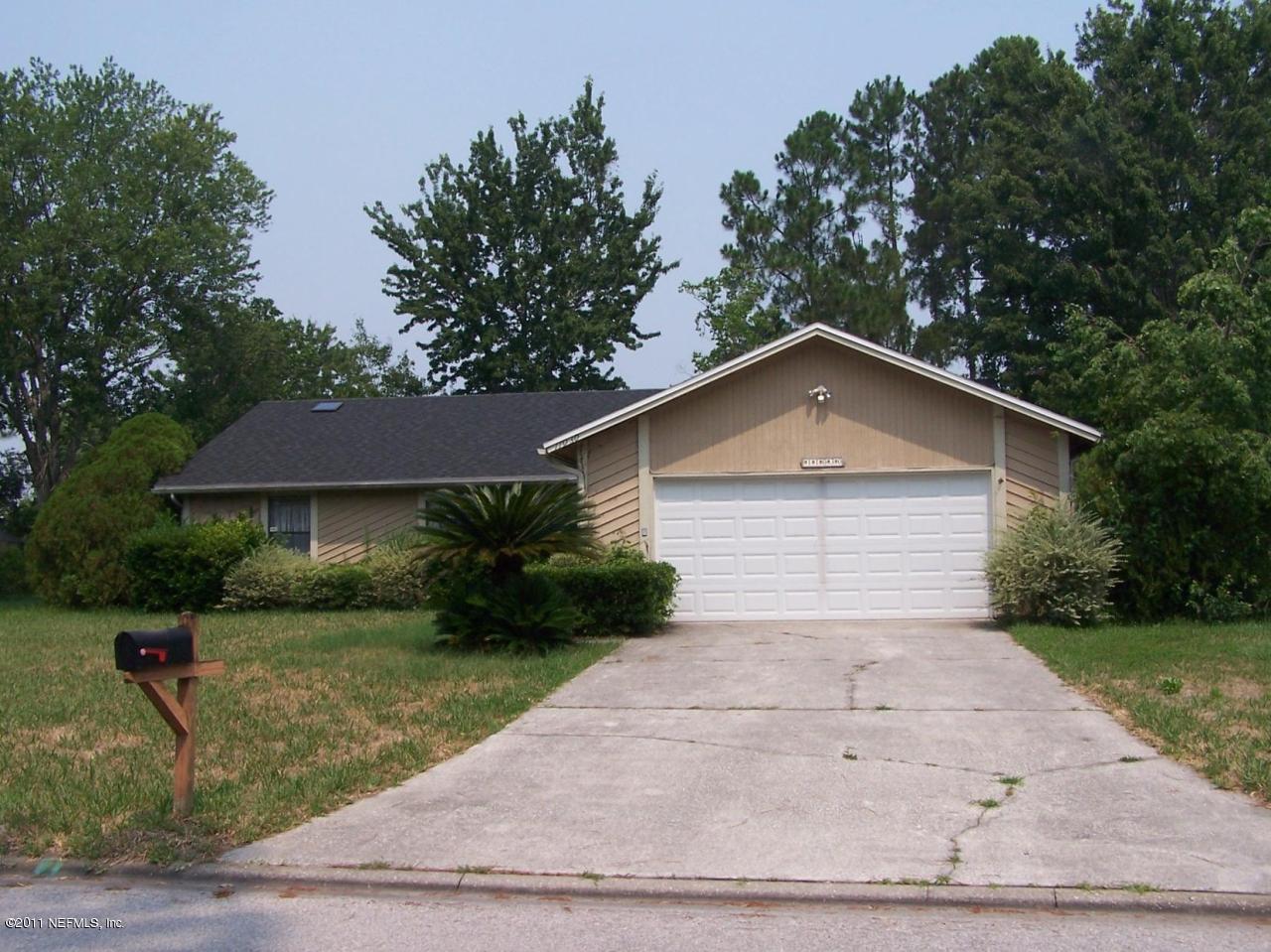 11030 Reading Road Jacksonville, FL 32257 - Photo 1 of 1 a view of a house with a yard plants and large tree