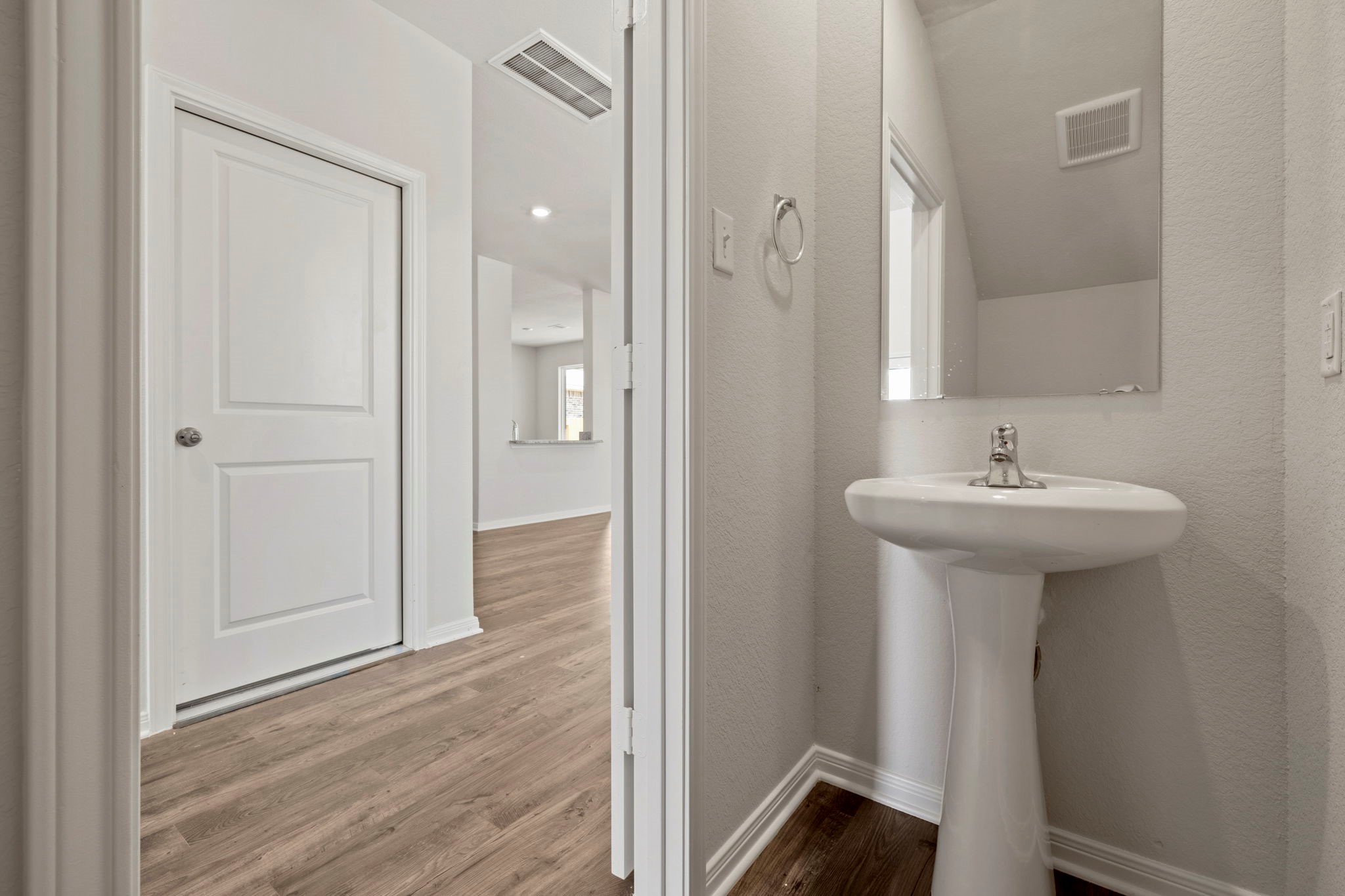 7610 Thrips Lane Richmond, TX 77469 - Photo 14 of 20 a bathroom with a sink a mirror and shower