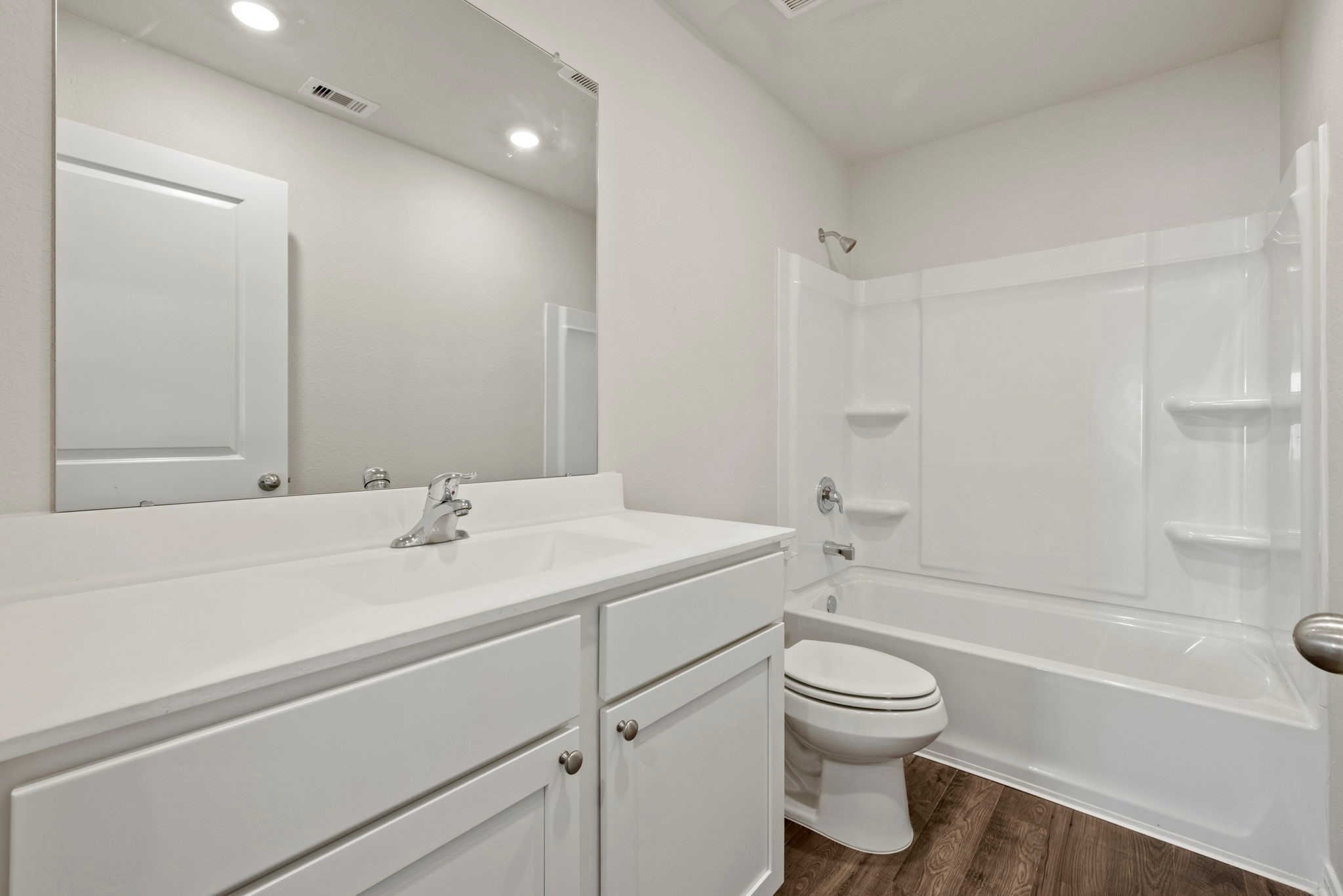 7610 Thrips Lane Richmond, TX 77469 - Photo 17 of 20 a bathroom with a sink toilet tub and vanity
