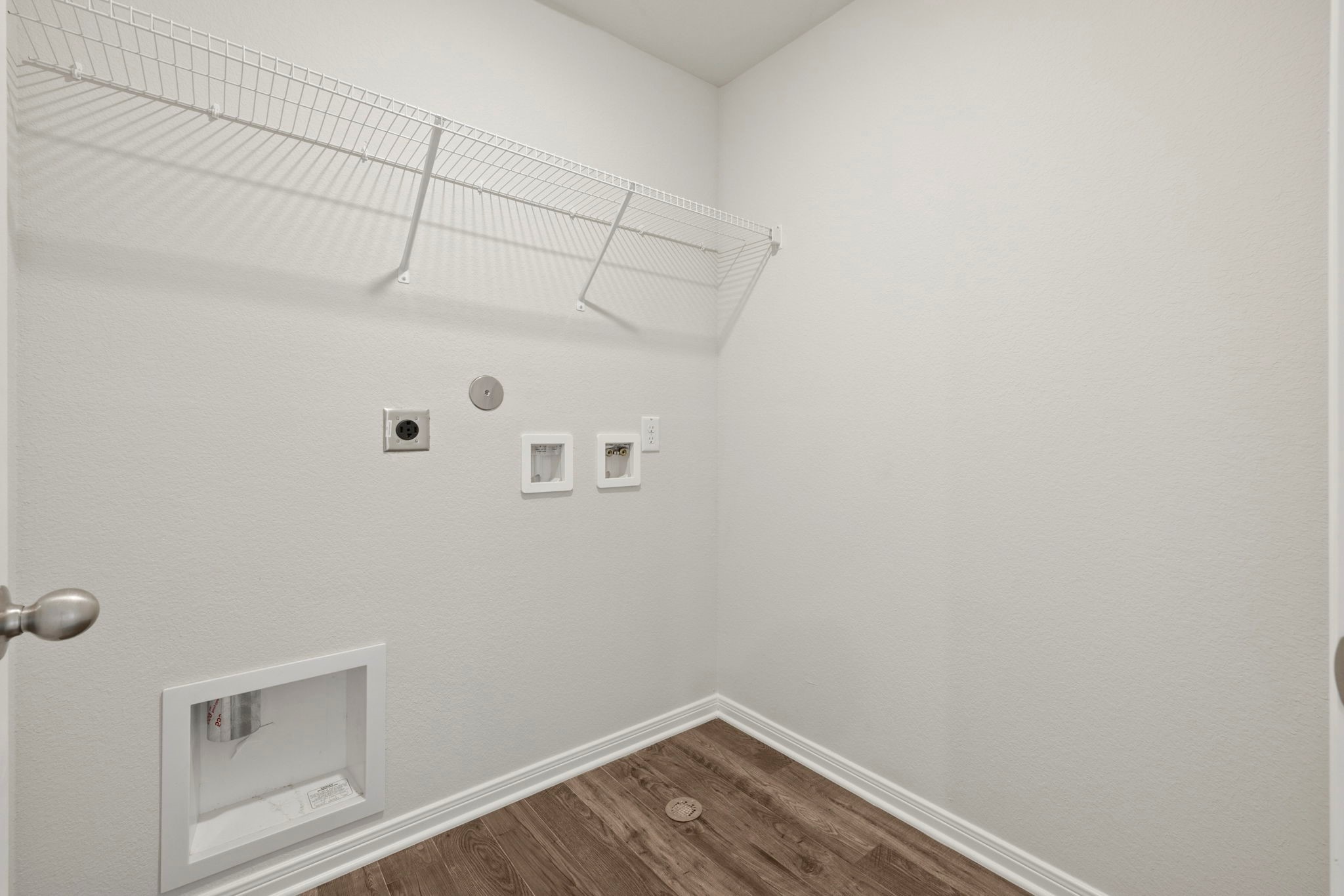 7610 Thrips Lane Richmond, TX 77469 - Photo 18 of 20 a view of a room with racks on the wall