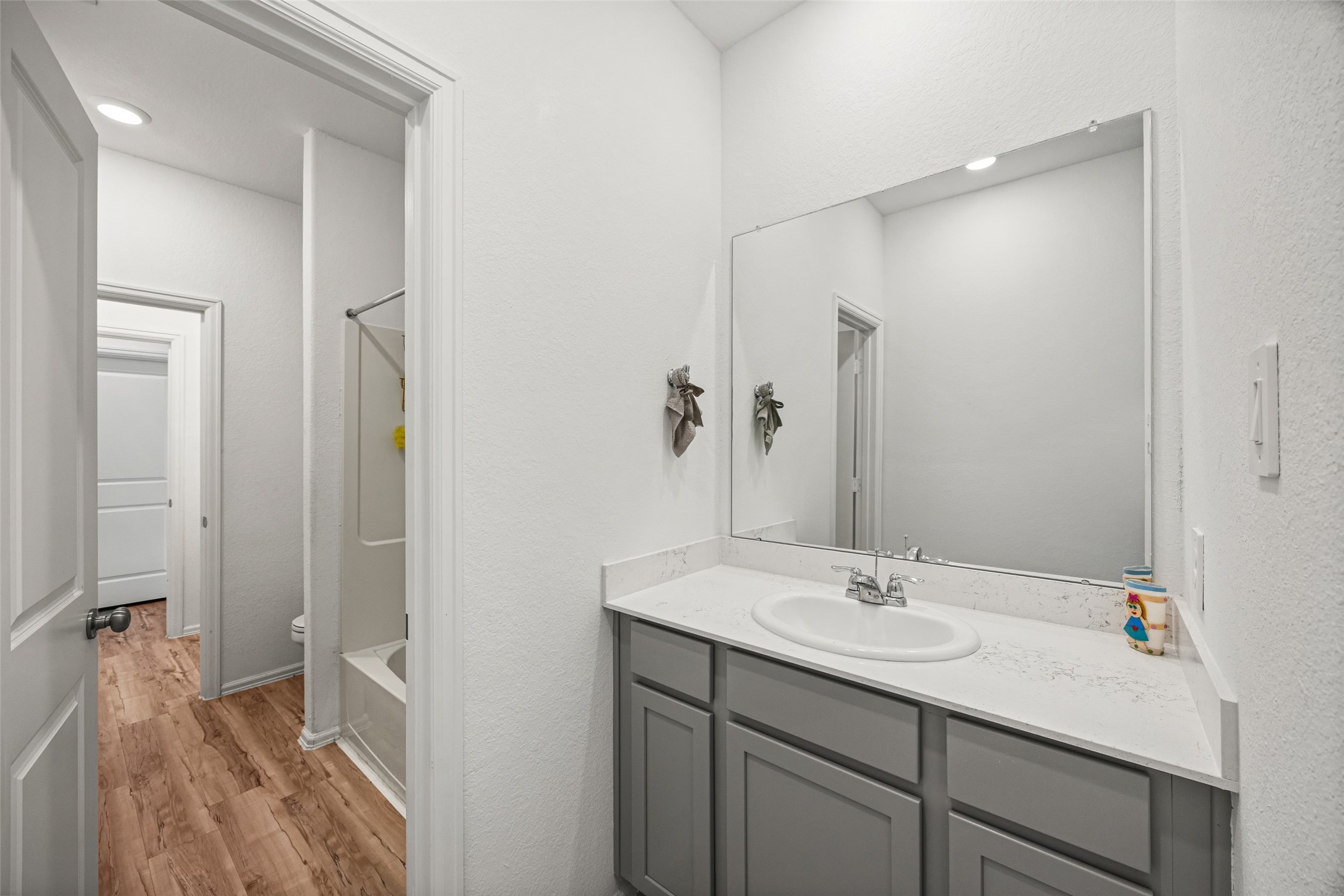 2822 Paradise Ridge Way Conroe, TX 77301 - Photo 15 of 21 a bathroom with a sink and a mirror
