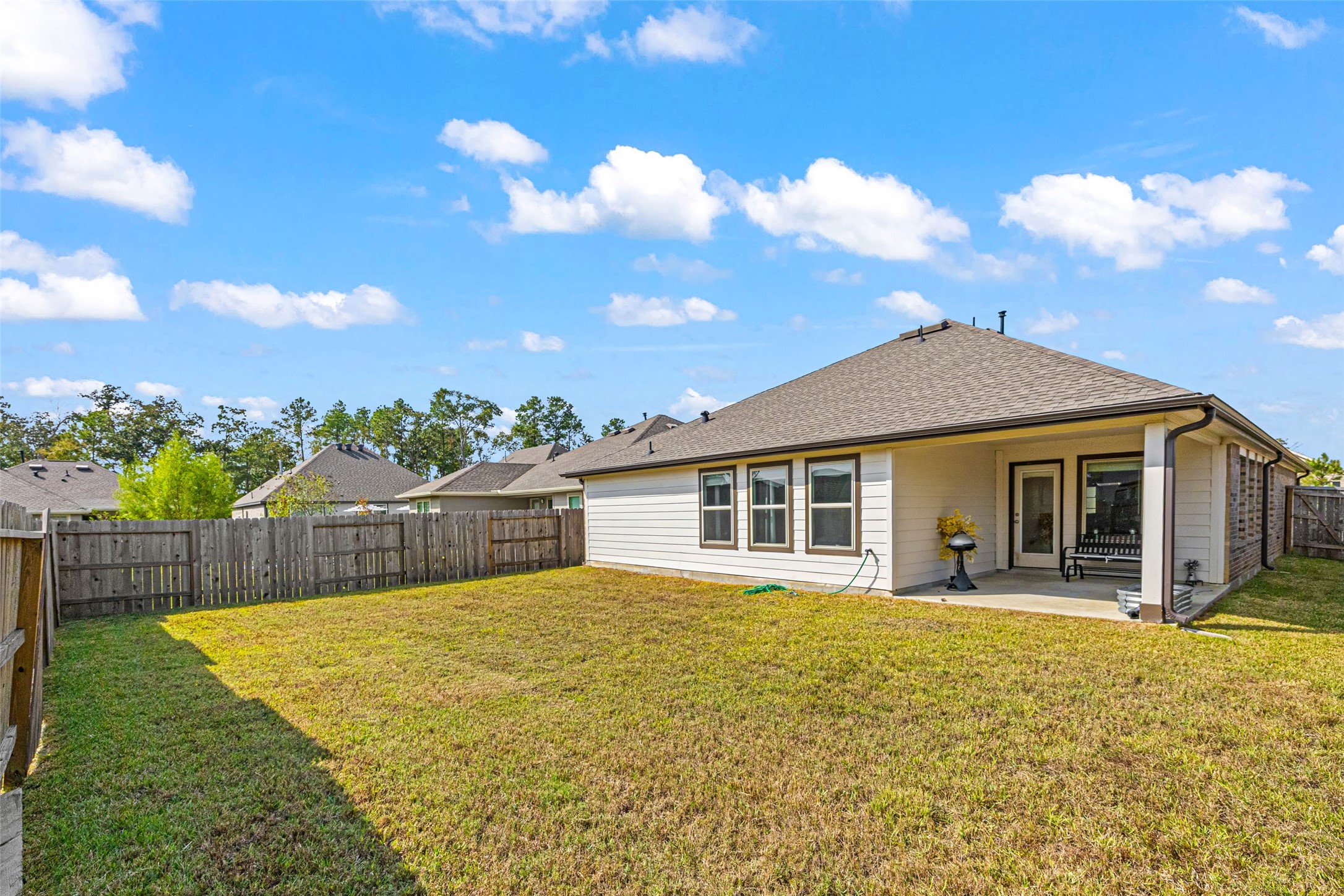 2822 Paradise Ridge Way Conroe, TX 77301 - Photo 20 of 21 a view of a house with a swimming pool