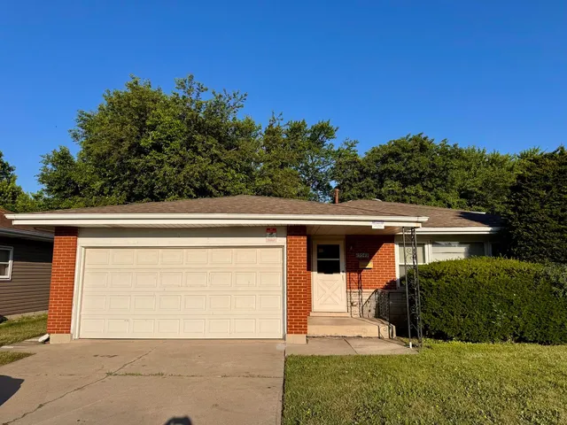 front view of a house with a small yard