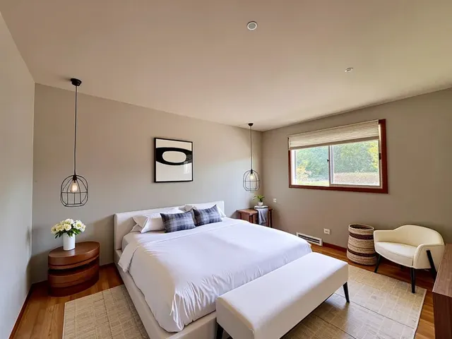 a bedroom with a bed and a couch