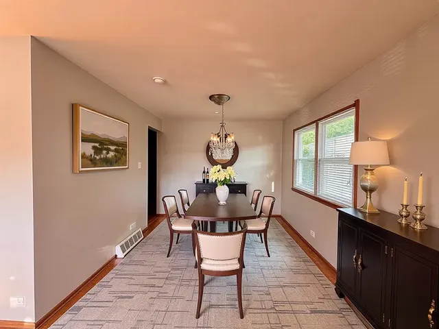 a dining room with furniture and window