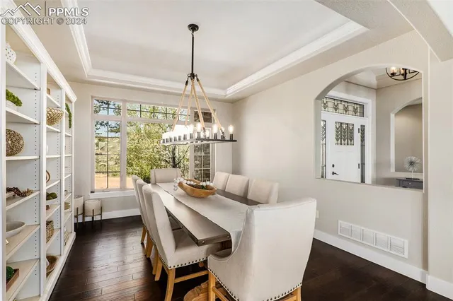 a kitchen with sink refrigerator and large window