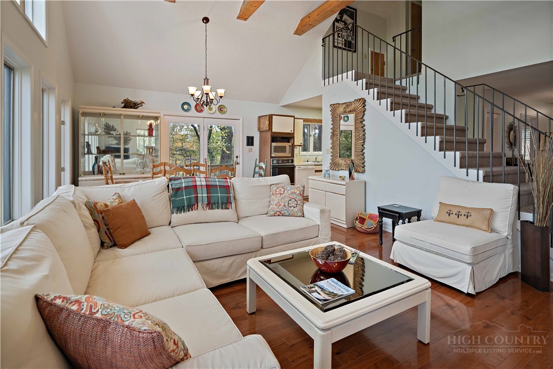 265 Leatherwood Road Banner Elk, NC 28604 - Photo 10 of 42 a living room with furniture and a chandelier