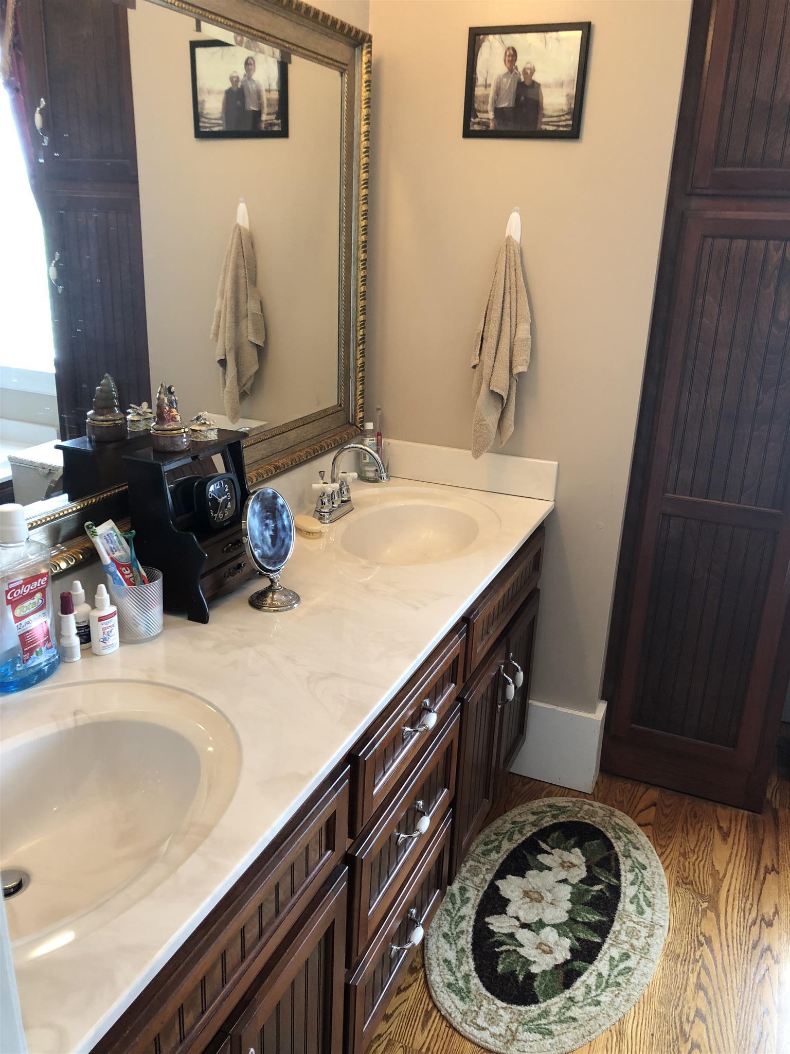 1108 Steele Road Franklin, KY 42134 - Photo 11 of 20 a bathroom with a sink and a mirror