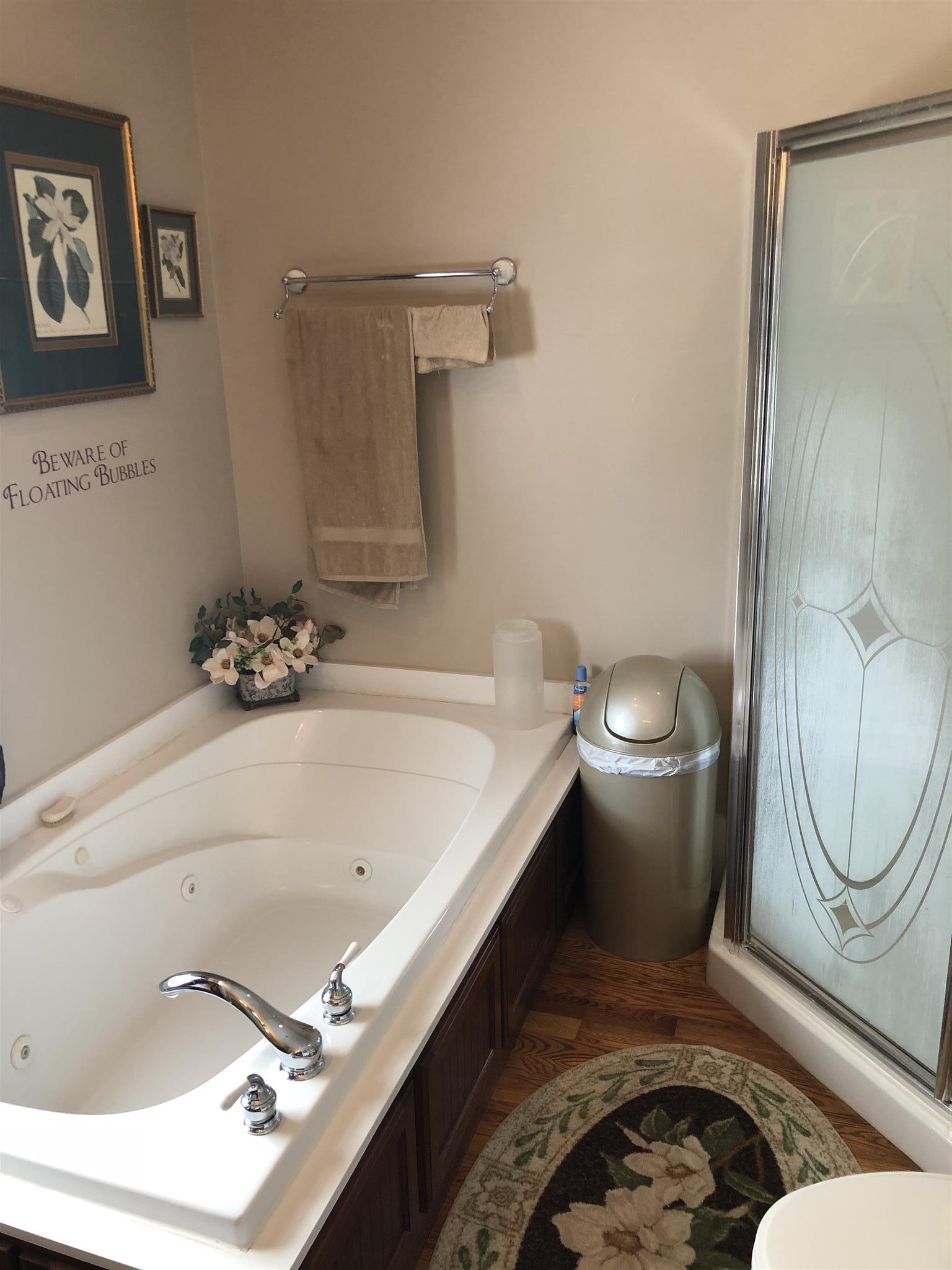 1108 Steele Road Franklin, KY 42134 - Photo 12 of 20 a bathroom with a sink a toilet and a mirror