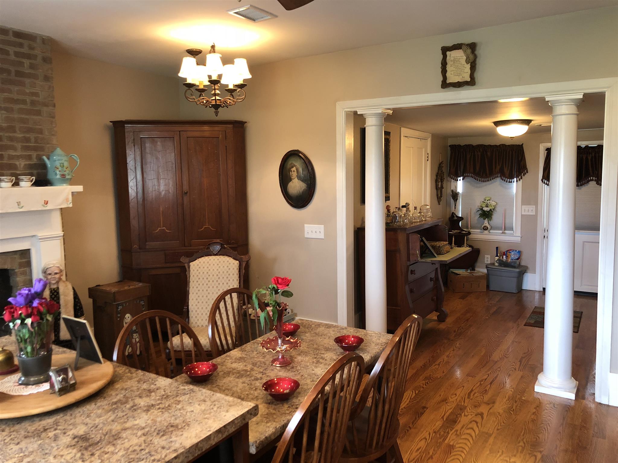 1108 Steele Road Franklin, KY 42134 - Photo 14 of 20 a dining room with chandelier fan and wooden floor