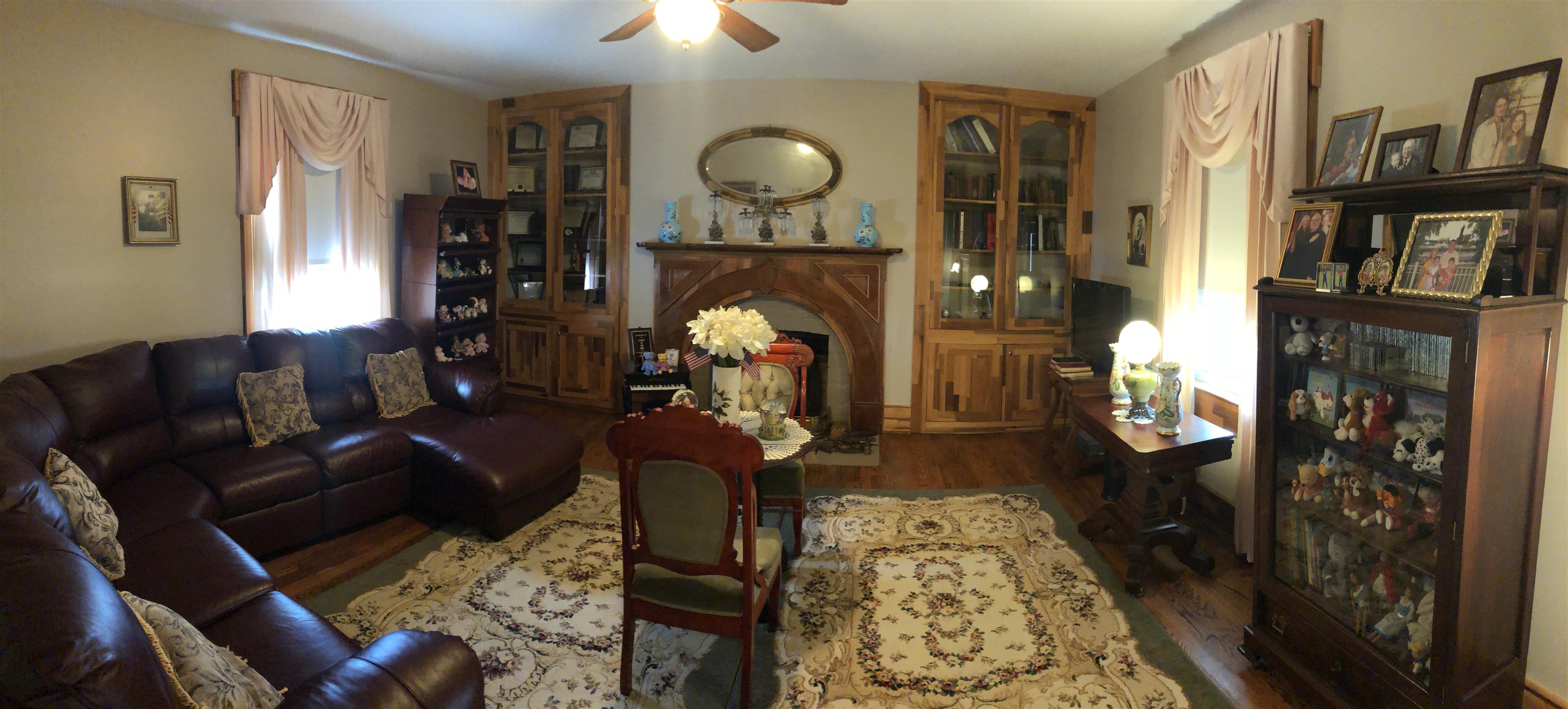 1108 Steele Road Franklin, KY 42134 - Photo 17 of 20 a living room with furniture a lamp and a fireplace