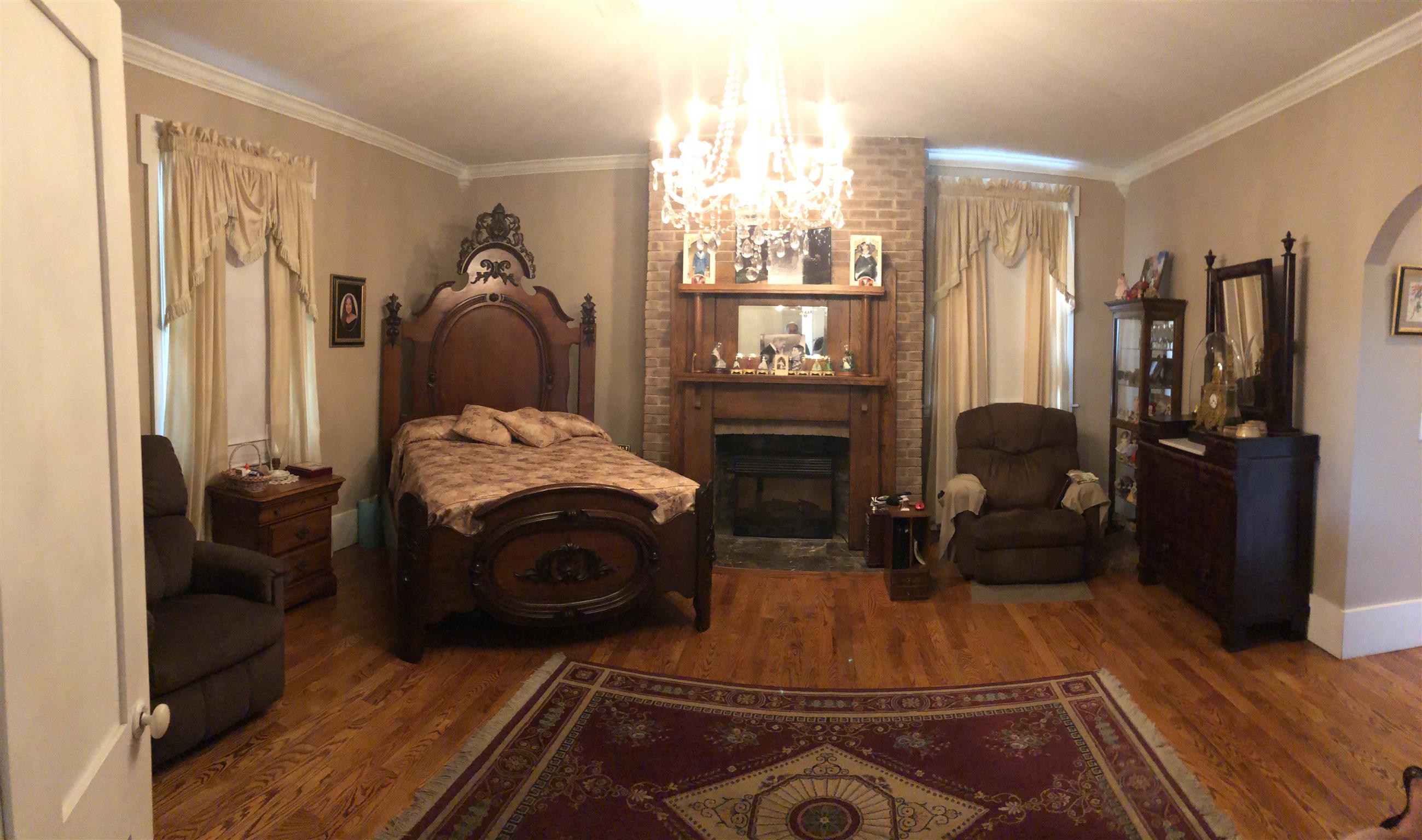 1108 Steele Road Franklin, KY 42134 - Photo 10 of 20 a room with furniture a flat screen tv and a fireplace