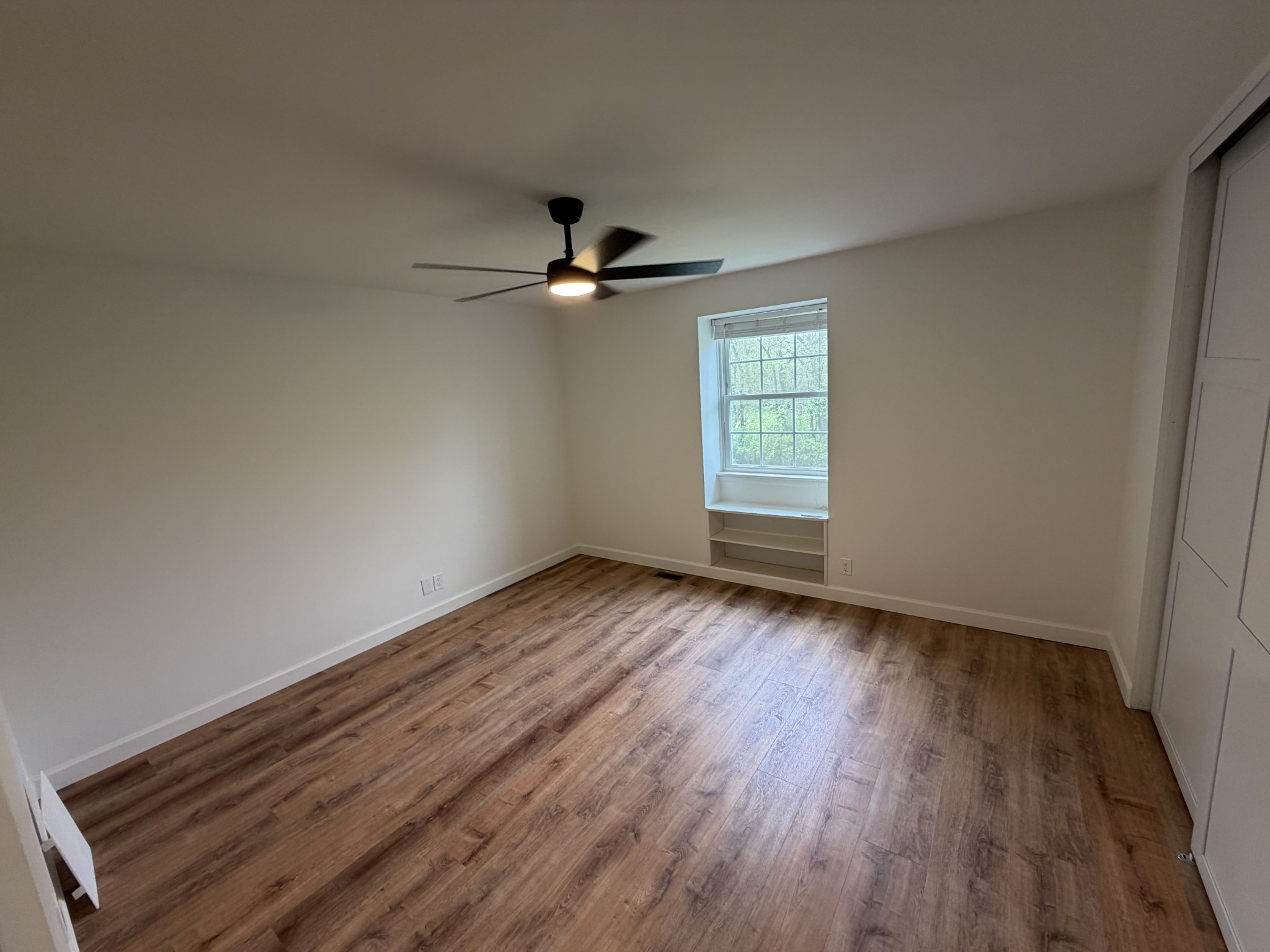 1100 West Main Street, Unit F7 Franklin, TN 37064 - Photo 6 of 10 wooden floor in an empty room with a window