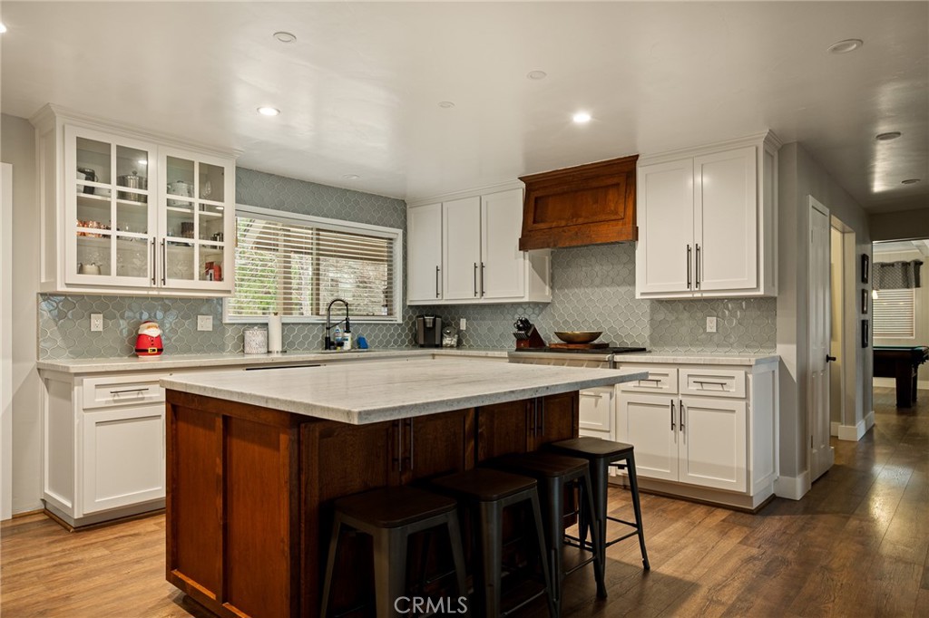 435 Riviera Drive Lake Arrowhead, CA 92352 - Photo 12 of 39 a kitchen with a sink stove cabinets and wooden floor