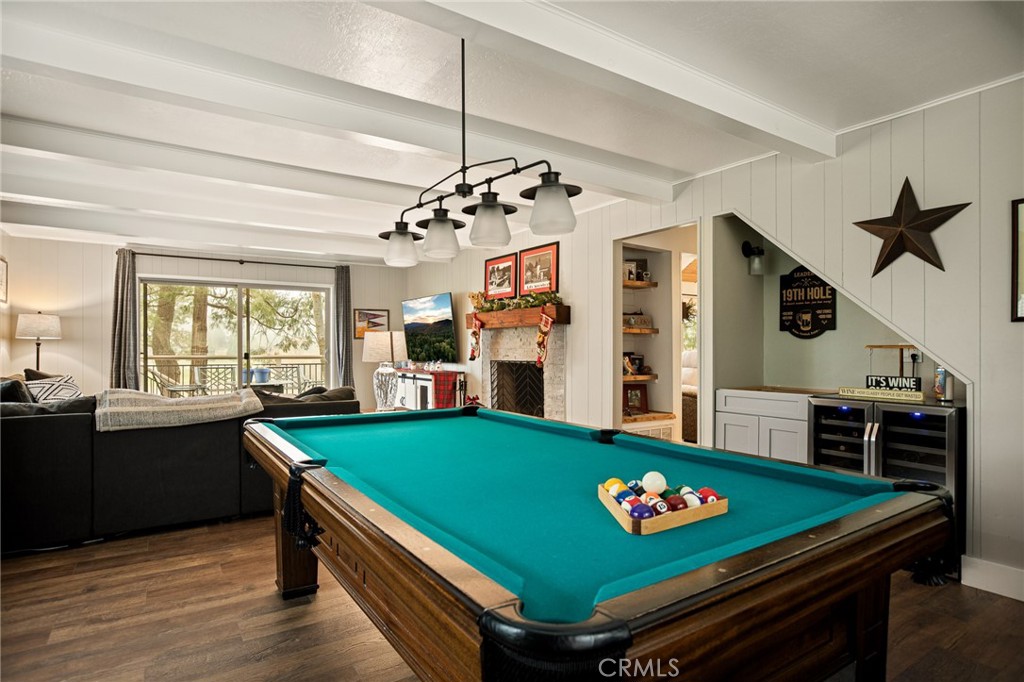 435 Riviera Drive Lake Arrowhead, CA 92352 - Photo 16 of 39 a room with pool table two windows and wooden floor