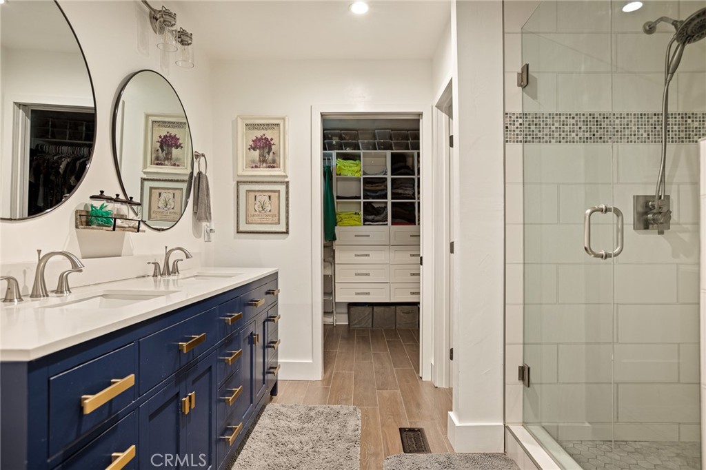435 Riviera Drive Lake Arrowhead, CA 92352 - Photo 22 of 39 a spacious bathroom with a granite countertop sink mirror and shower