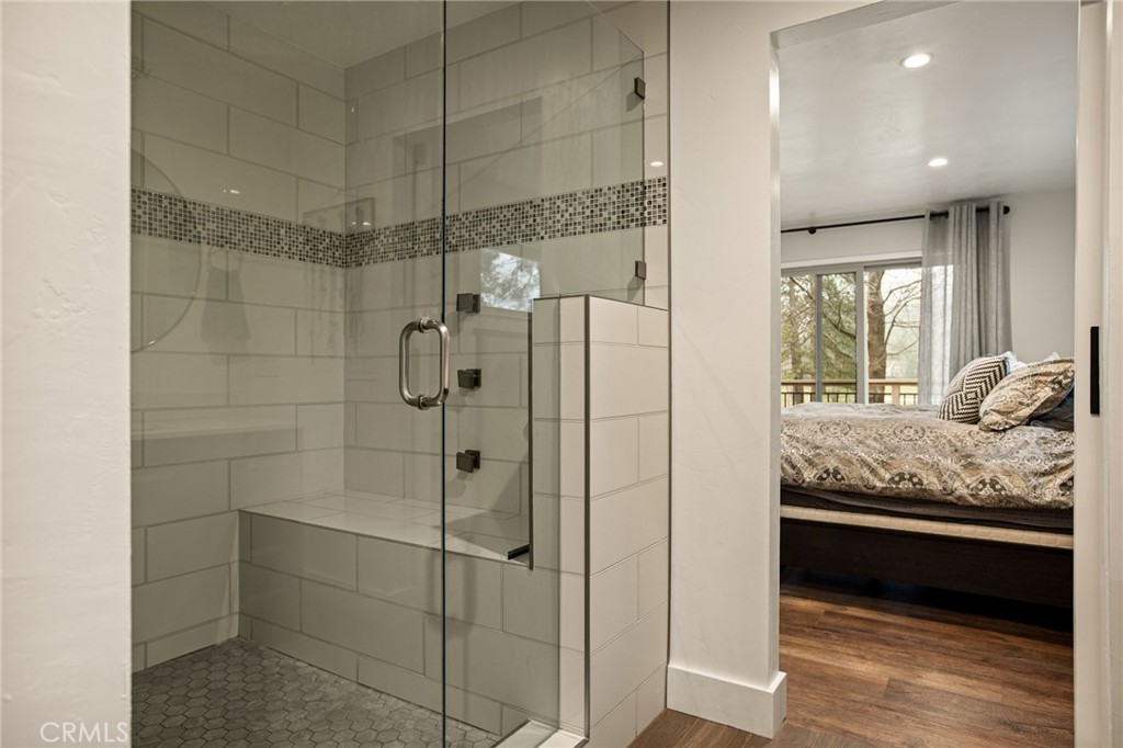 435 Riviera Drive Lake Arrowhead, CA 92352 - Photo 23 of 39 a bathroom with a granite countertop shower a sink and granite counter tops
