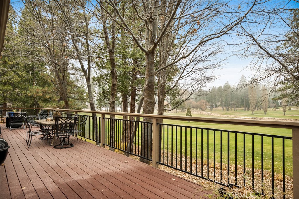 435 Riviera Drive Lake Arrowhead, CA 92352 - Photo 25 of 39 a view of balcony with seating space and trees in the background