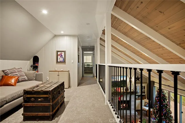 a living room with furniture windows and a flat screen tv