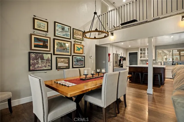 a outdoor dining space with furniture and wooden floor
