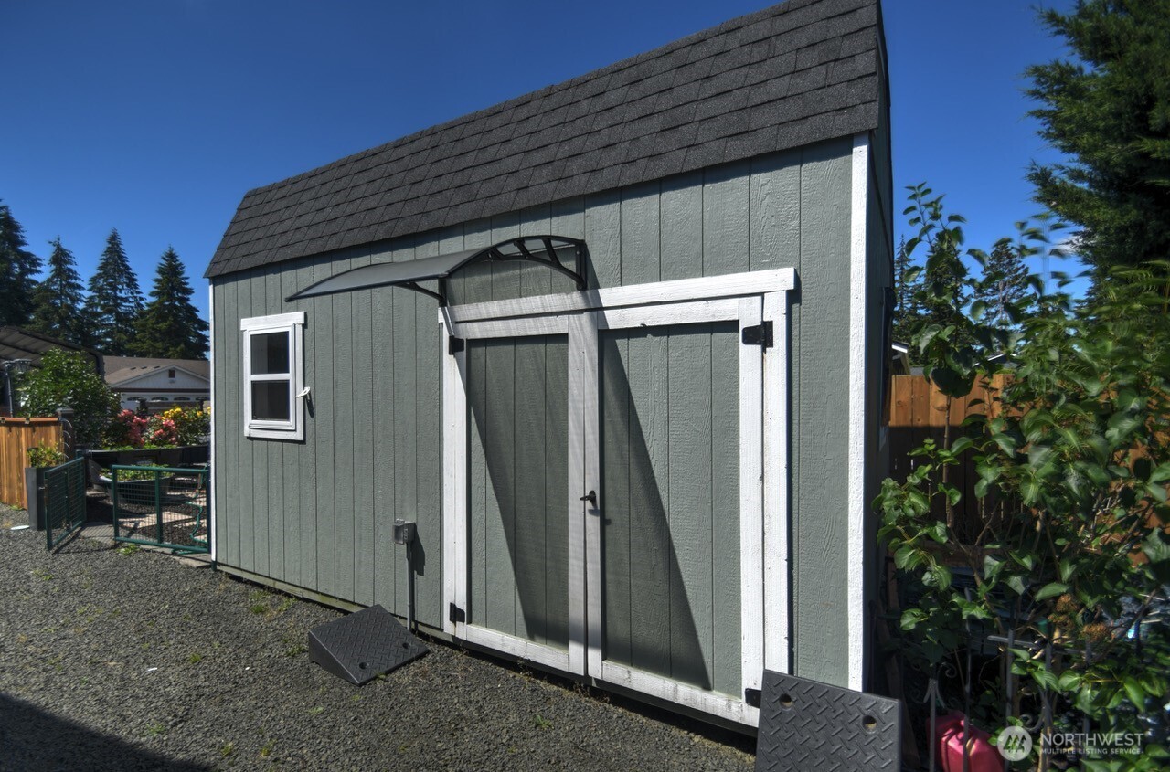 5922 184th Lane Southwest Rochester, WA 98579 - Photo 19 of 34 a view of a house with backyard