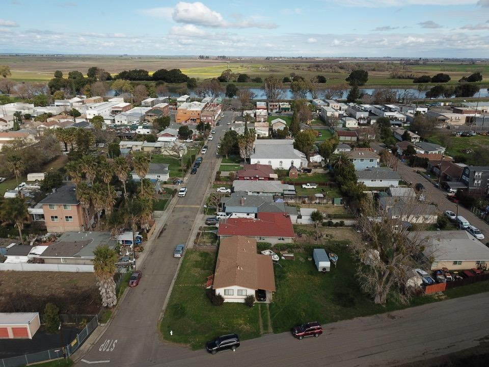 an aerial view of residential houses with city view
