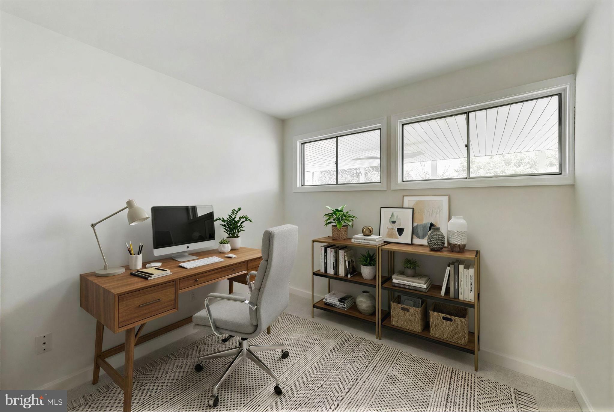 7402 Inzer Street Springfield, VA 22151 - Photo 18 of 49 a view of a workspace with furniture and a window