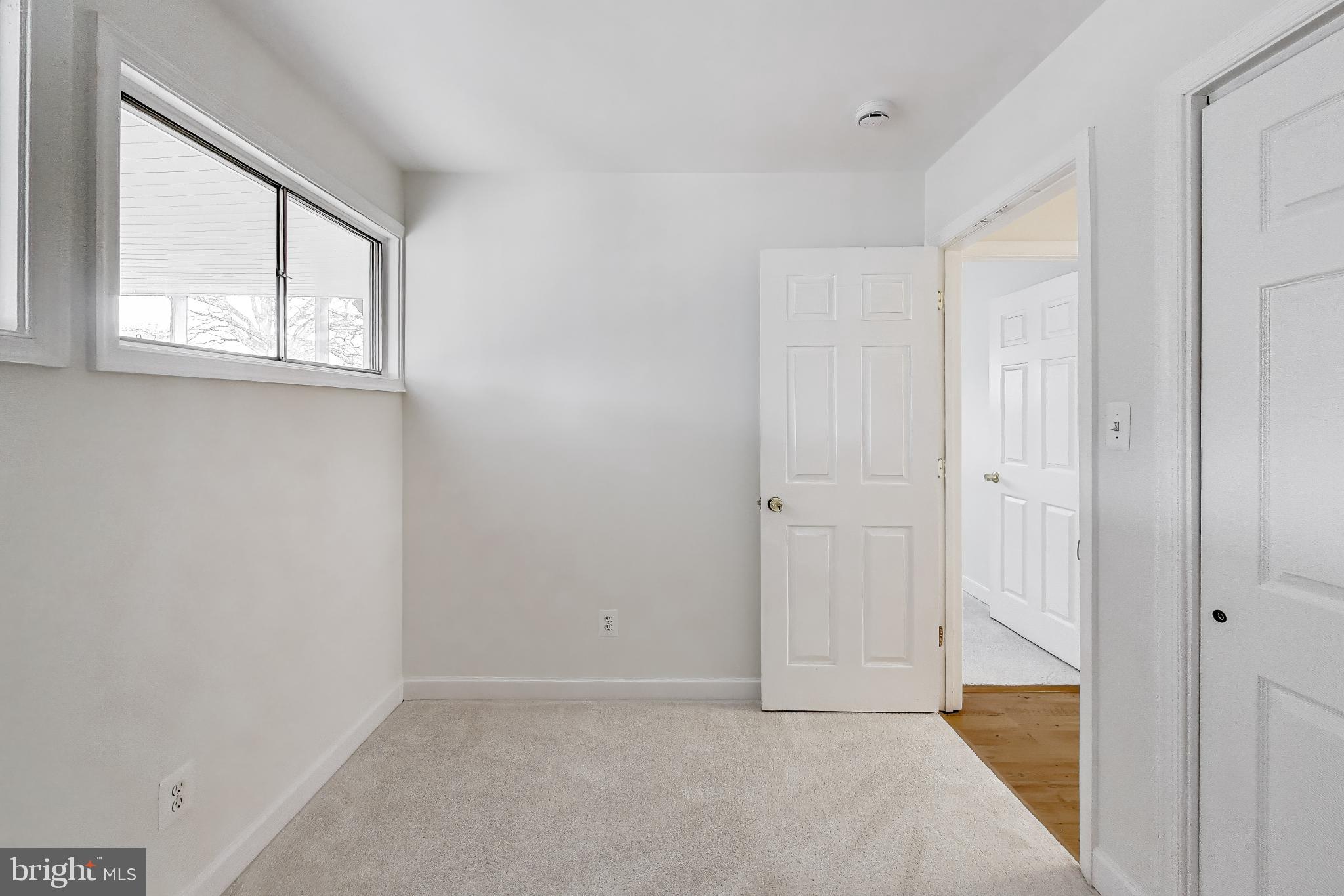7402 Inzer Street Springfield, VA 22151 - Photo 19 of 49 an empty room with windows and closet