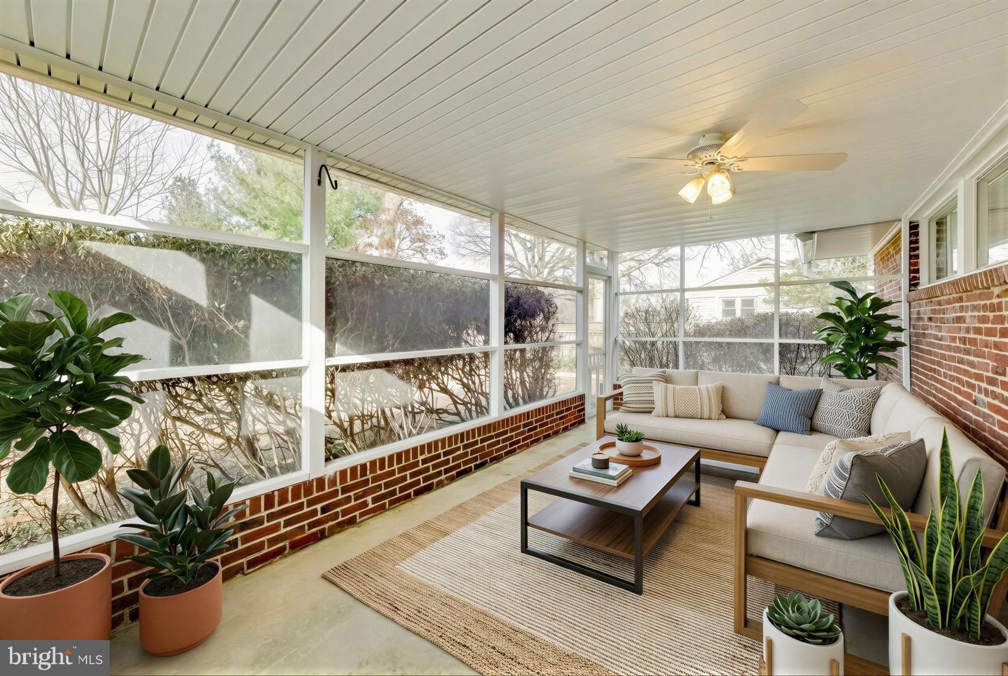 7402 Inzer Street Springfield, VA 22151 - Photo 24 of 49 a living room with furniture and a large window