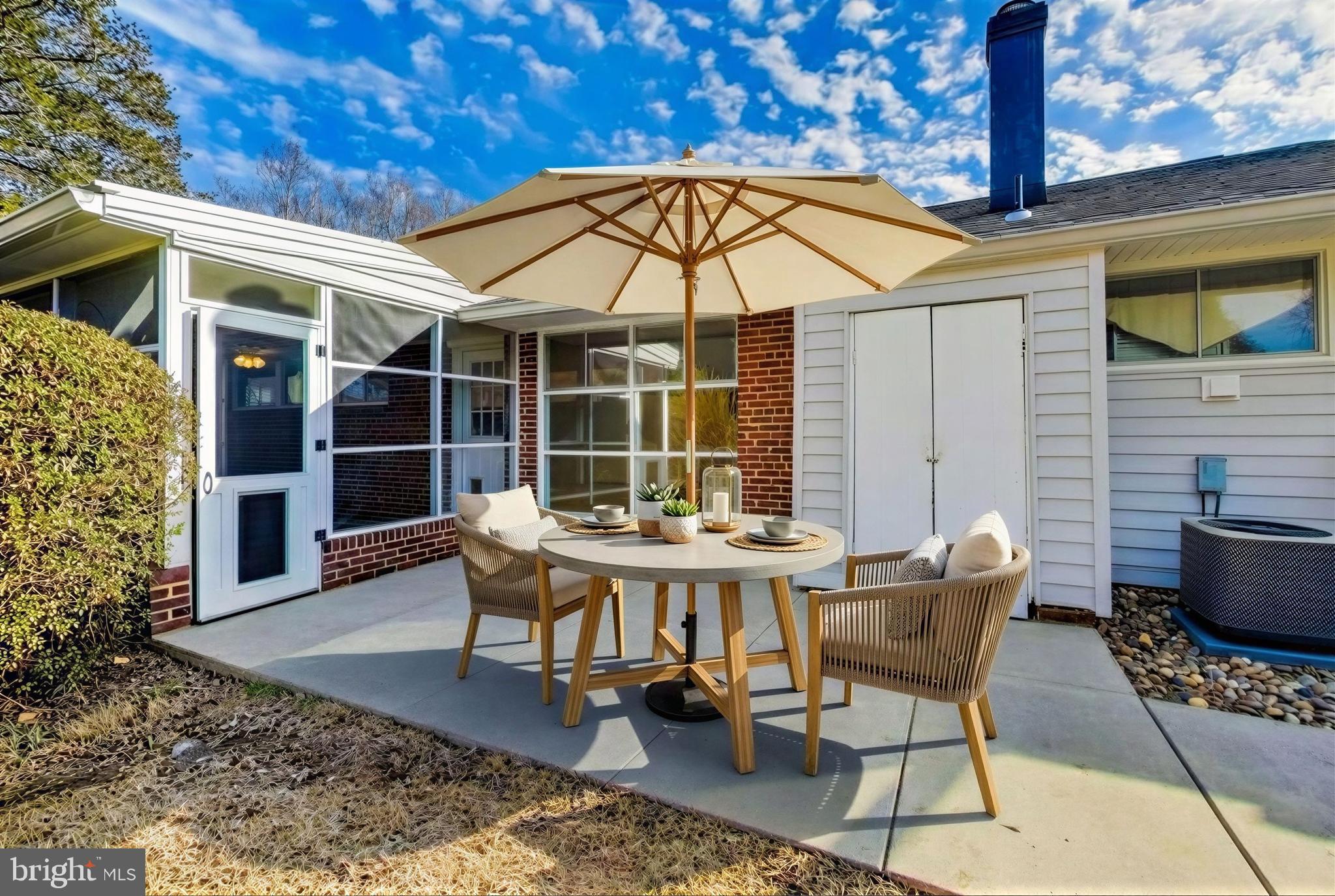 7402 Inzer Street Springfield, VA 22151 - Photo 26 of 49 a backyard of a house with table and chairs