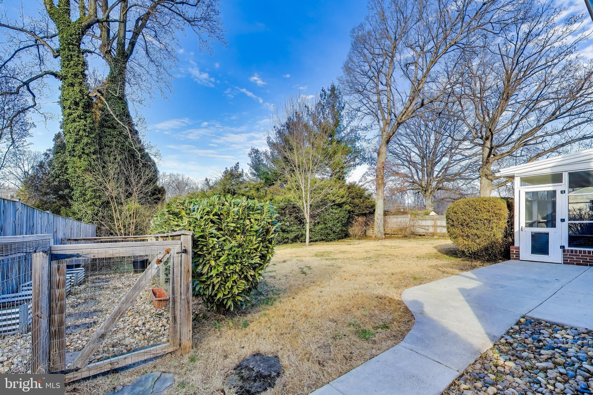 7402 Inzer Street Springfield, VA 22151 - Photo 28 of 49 a view of a couches in the patio and a trees