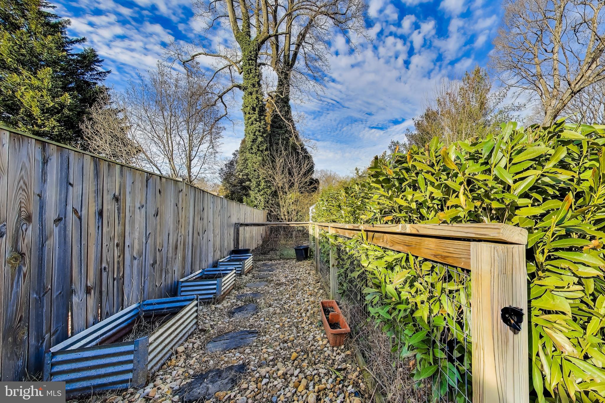 7402 Inzer Street Springfield, VA 22151 - Photo 29 of 49 a view of a pathway with a wooden fence