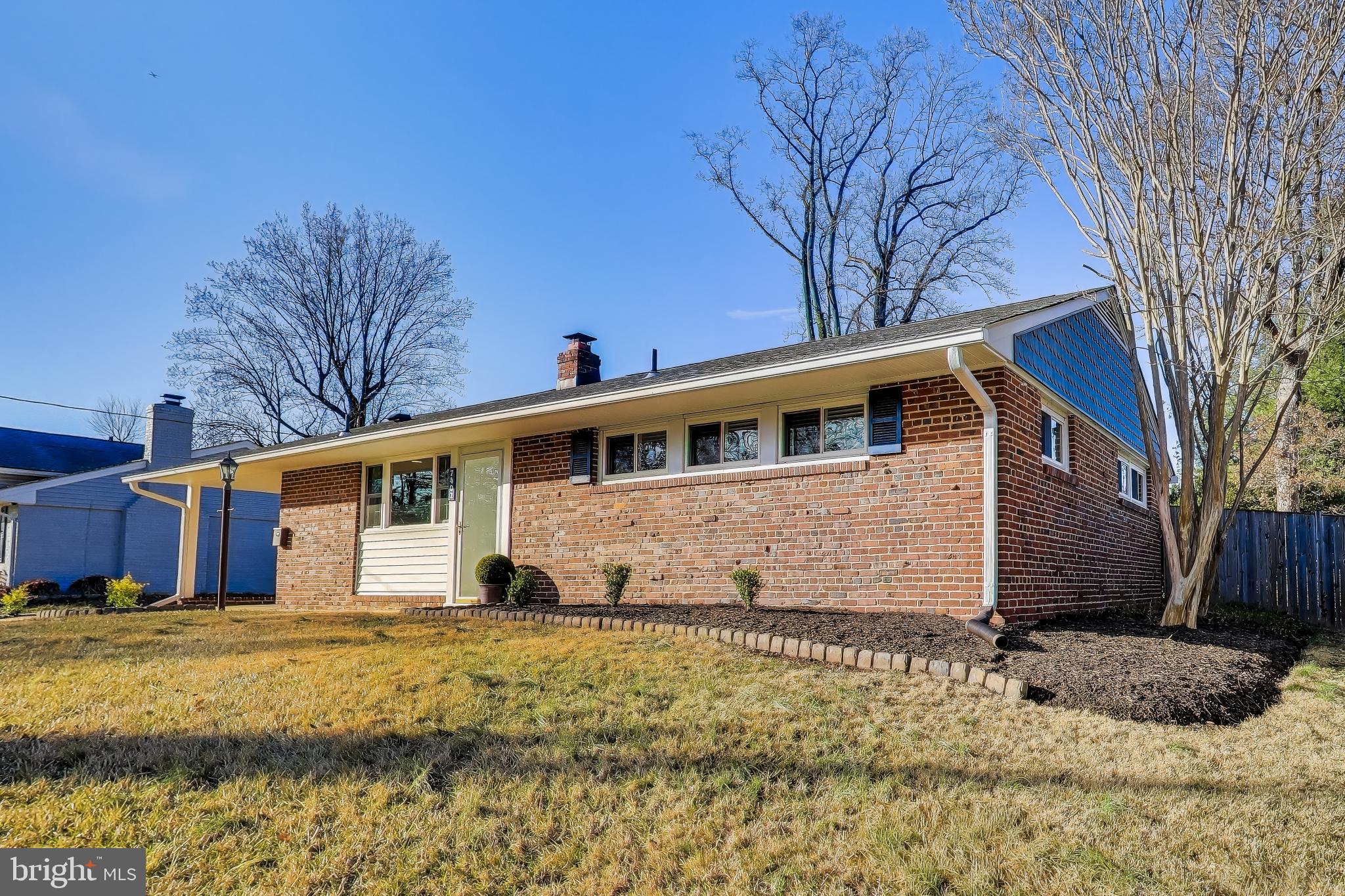7402 Inzer Street Springfield, VA 22151 - Photo 3 of 49 a view of a house with a yard