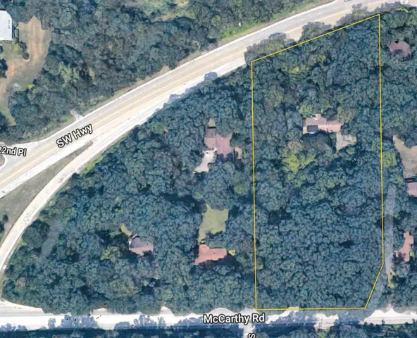 a view of a forest from a balcony