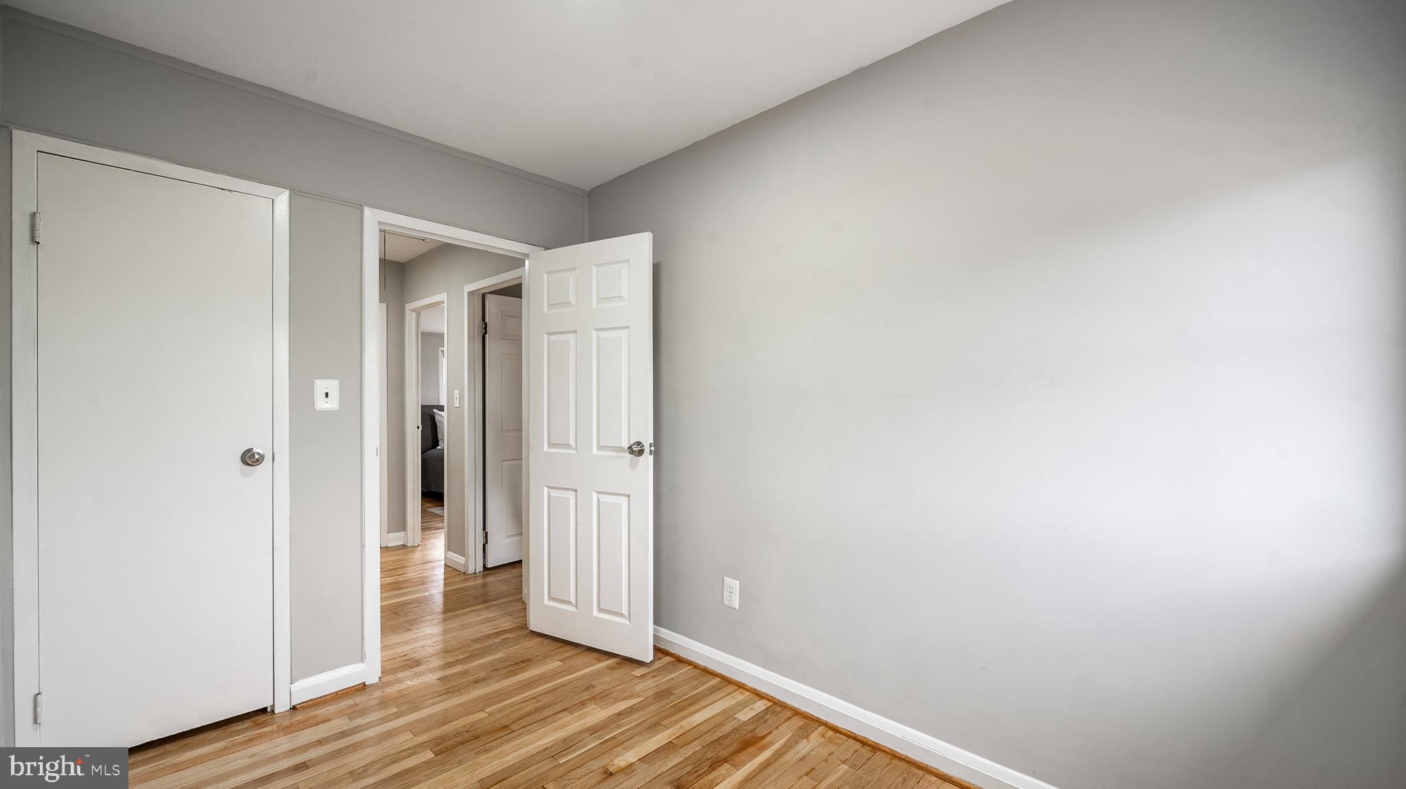 7913 Charlesmont Road Baltimore, MD 21222 - Photo 18 of 27 a view of a hallway with wooden floor