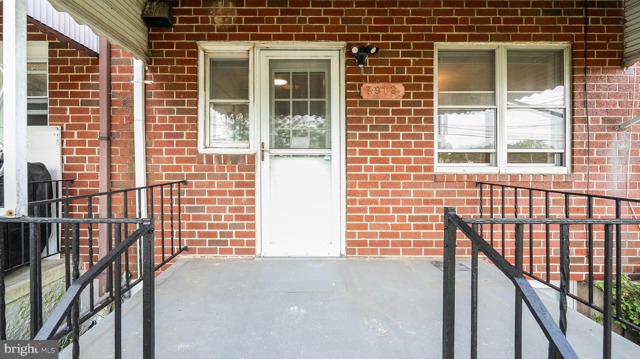 7913 Charlesmont Road Baltimore, MD 21222 - Photo 24 of 27 a view of a brick house with a large window