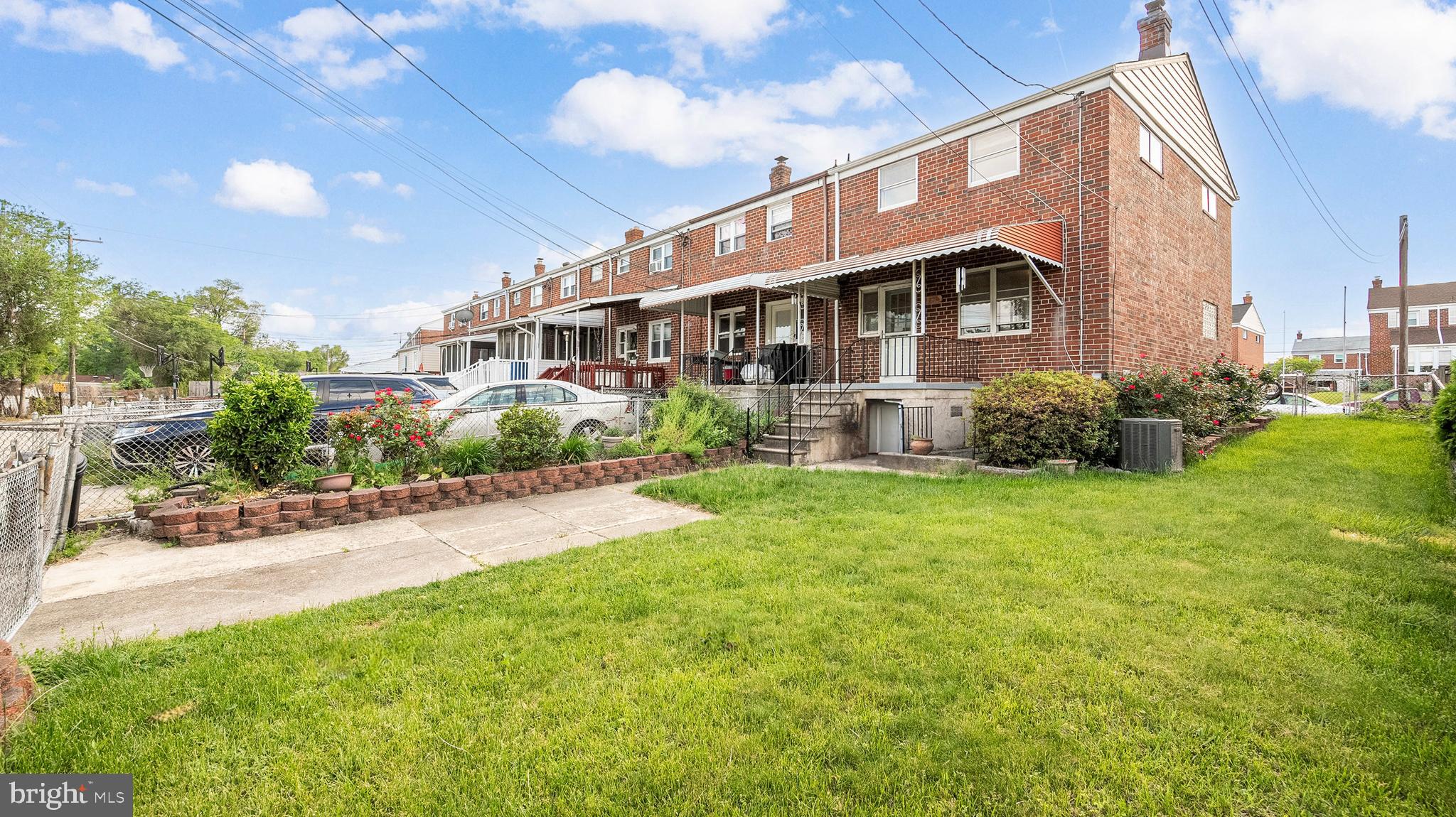 7913 Charlesmont Road Baltimore, MD 21222 - Photo 26 of 27 a front view of a house with garden