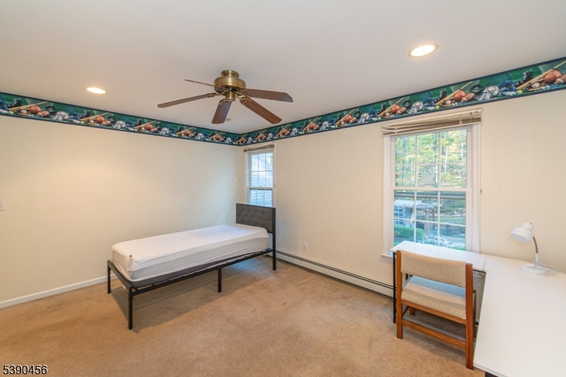 190 Andover Mohawk Road Andover, NJ 07821 - Photo 17 of 46 a bedroom with a bed and a window