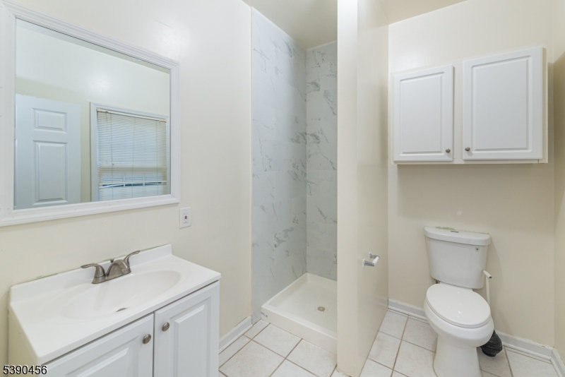 190 Andover Mohawk Road Andover, NJ 07821 - Photo 25 of 46 a bathroom with a sink toilet and vanity