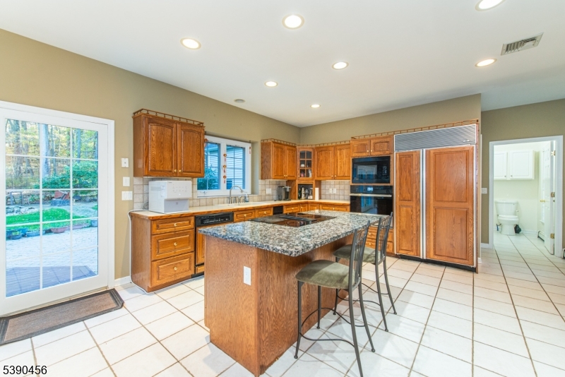 190 Andover Mohawk Road Andover, NJ 07821 - Photo 28 of 46 a kitchen with stainless steel appliances granite countertop a stove a sink and a refrigerator
