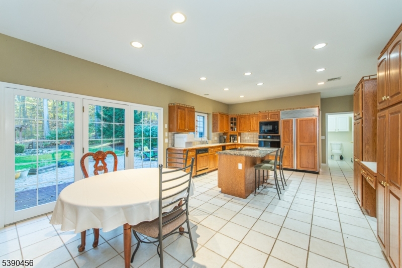 190 Andover Mohawk Road Andover, NJ 07821 - Photo 29 of 46 a dining room with furniture and a floor to ceiling window