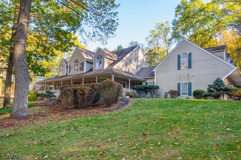 190 Andover Mohawk Road Andover, NJ 07821 - Photo 3 of 46 a house that has a tree in front of it
