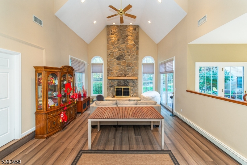 190 Andover Mohawk Road Andover, NJ 07821 - Photo 31 of 46 a bed room with a bed and a fireplace