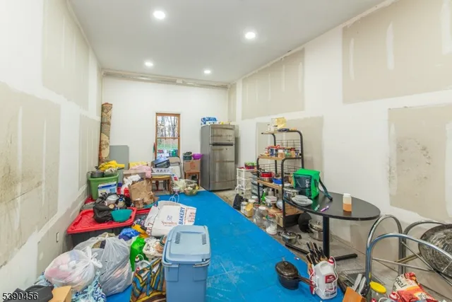 a room with gym equipment and a large window