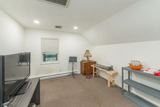 a room with furniture and a flat screen tv