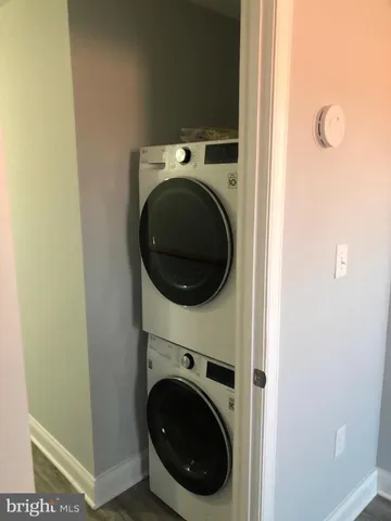 a view of a hallway with washer and dryer