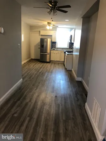 a view of a livingroom with furniture and wooden floor