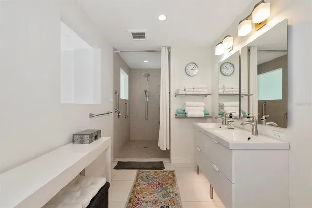 a bathroom with a sink a toilet a mirror and vanity