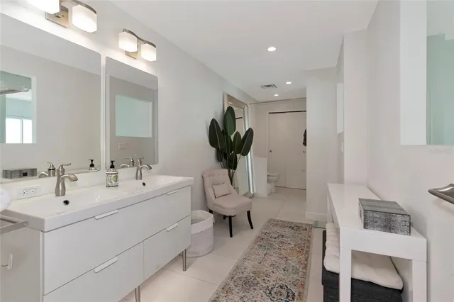 a bathroom with a double vanity sink and a mirror