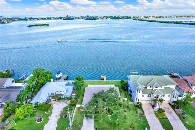 an aerial view of a house with a lake view